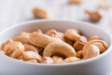 Roasted cashew nuts on rustic wood