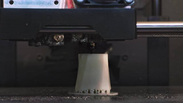 Printing with Plastic Wire Filament on 3D Printer. some kind of plastic part. Replacement part. 3D printer prints