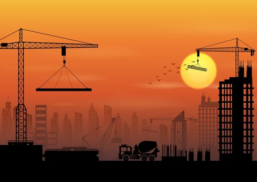 Construction site silhouettes at sunset
