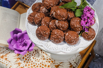 the tables with the desserts . decorated plates of cookies , biscuits. A wedding Banquet . Extra pounds and calories . Sweets of various kinds