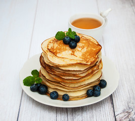 Plate with pancakes and blueberries