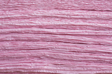 Pink tissue paper stacked may be used as background