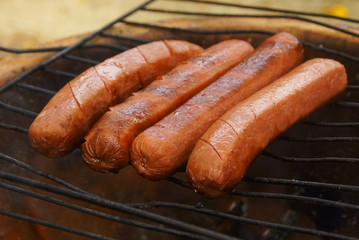 Closeup of sausage on the grill