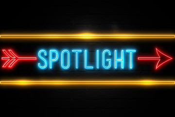 Spotlight  - fluorescent Neon Sign on brickwall Front view