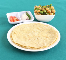Jowar roti or sorghum flat bread, which is an healthy Indian vegetarian food made from the dough of sorghum flour.