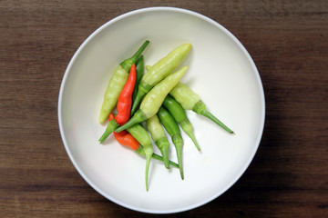 Red and green Bird's Eye Chili pepper on white background, Hot and spicy, prepare food.
