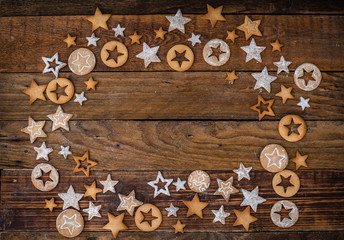 Stylish Christmas cookies on a wooden table with Powdered sugar. Star shape. Space for inscription