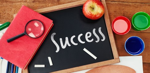 Composite image of success text against white background