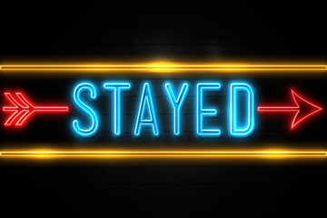 Stayed  - fluorescent Neon Sign on brickwall Front view