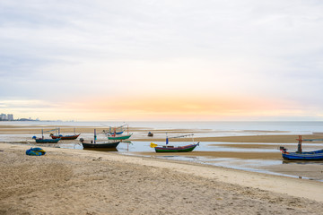 Fototapeta na wymiar Old wooden fishing boat on the Hua Hin beach
