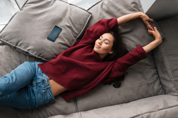 Top view of a young beautiful asian woman in sweater