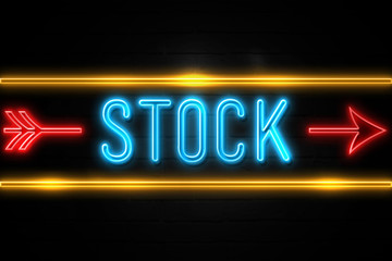 Stock  - fluorescent Neon Sign on brickwall Front view
