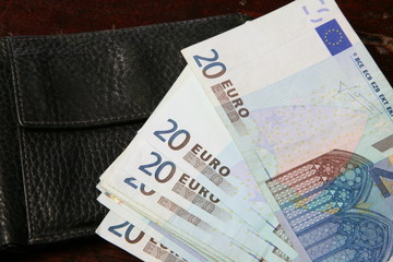 euro banknotes in leather wallet