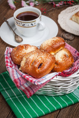 Buns with berries on a wooden table.