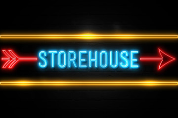 Storehouse - fluorescent Neon Sign on brickwall Front view