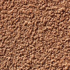 Rough stucco textured background of a wall with natural light. Abstract texture of plaster.