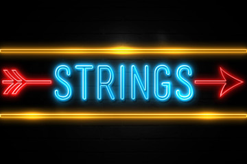 Strings  - fluorescent Neon Sign on brickwall Front view