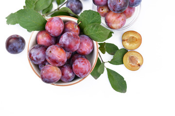 Plums in bowl top view.