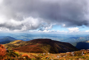 arpathian mountains autumn landscape with blue sky and clouds, natural travel background