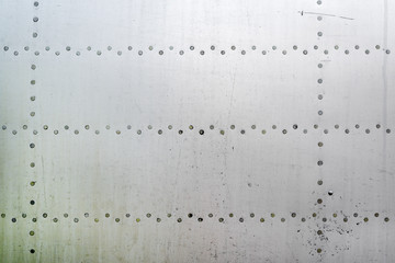Aluminum surface of the aircraft fuselage.