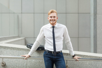 Happiness young adult success businessman, looking at camera and toothy smile.