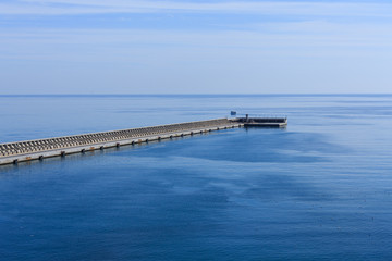 Fototapeta na wymiar Malaga Seawal Into Blue Sea and Sky