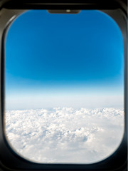 Airplane Window View Above The Clouds