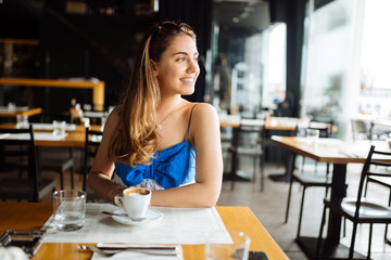 Stunning woman enjoying her coffee