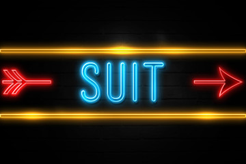 Suit  - fluorescent Neon Sign on brickwall Front view