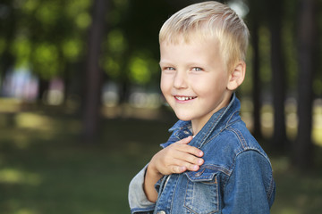 Portrait of a young boy in a jeans jacket