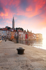 Sunset at medieval town of Rovinj, colorful with houses and church