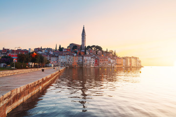 Fototapeta na wymiar Sunset at medieval town of Rovinj, colorful with houses and church