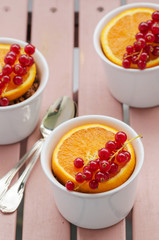 Fresh orange and redcurrant dessert