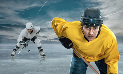 Ice hockey player on the ice in mountains
