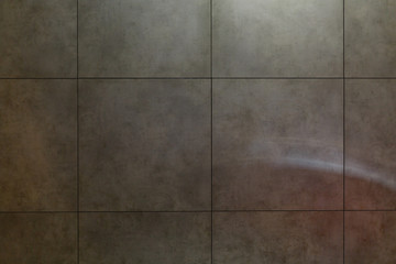 Wall grey tiles background.