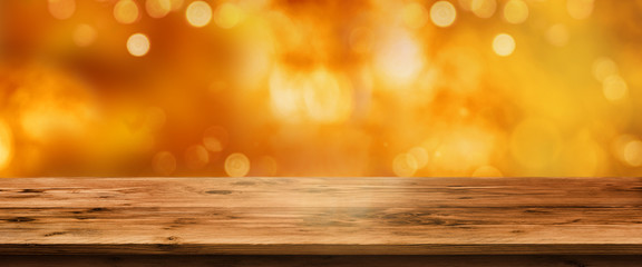 Bright autumn background with wooden table