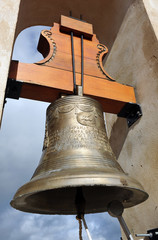 Bronze bell in the bell tower of the church