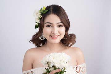 Beautiful asian woman bride on grey background. Closeup portraits with a professional makeup