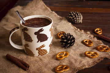 cup of hot chocolate on a linen centerpiece cookies and cones