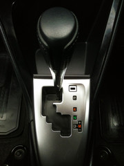 Closeup automatic gear stick in car made with black leather and metal design look modern and luxury