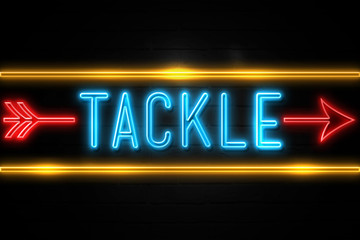 Obraz premium Tackle - fluorescent Neon Sign on brickwall Front view