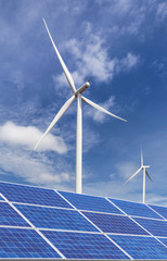 solar cells and wind turbines generating electricity in  power station alternative renewable energy from nature  Ecology concept.   