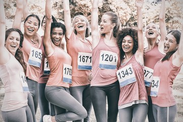 Female breast cancer marathon runners cheering