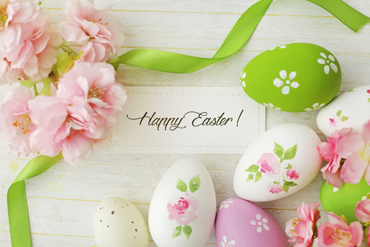 easter greeting card with easter eggs and flowers