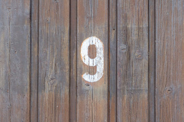 Number 9 written on a door