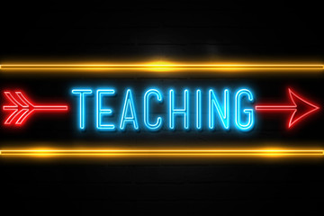 Teaching  - fluorescent Neon Sign on brickwall Front view