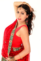 Woman dancing Indian dance in national dress. A handsome beautiful girl portrait in red Hindu...