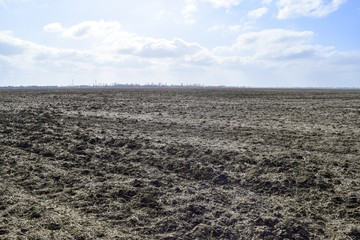 The plowed field. Spring processing of farmlands.