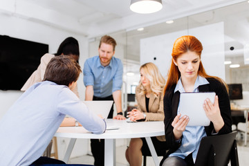 Business colleagues sitting at desk