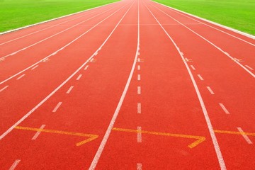 red running track on athletic stadium